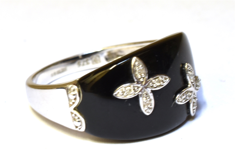 A 9CT WHITE GOLD BLACK ONYX DIAMOND SET RING The curved black onyx front inset with two small four - Image 2 of 2