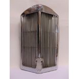 A TRIUMPH CHROME RADIATOR with an inset enamel globe badge, 67cm high.