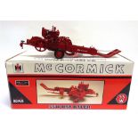 A 1/16 SCALE SPEC CAST RESIN MCCORMICK 55W HAY BALER boxed.