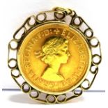 A FULL SOVEREIGN GOLD PENDANT The coin dated 1966 to a 9ct gold scroll mount, gross weight approx.