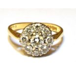 A DIAMOND CLUSTER 18CT GOLD RING The round diamond cluster a total of nine round brilliant cut