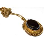 A VICTORIAN BANDED BLACK AGATE OVAL PENDANT And later 9ct gold chain, the Etruscan style oval