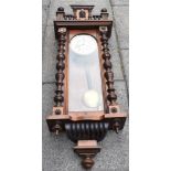 A GUSTAV BECKER REGULATOR WALL CLOCK in walnut case, with two weights, 44cm wide 127cm high