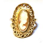 A HALLMARKED 9CT YELLOW GOLD CAMEO DRESS RING Small oval cameo to open work, oval head, ring size N,