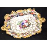 AN EARLY VICTORIAN CHAMBERLAINS WORCESTER DISH with floral painted decoration within a shell border,