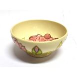 A MOORCROFT POTTERY BOWL DECORATED IN THE 'MAGNOLIA' PATTERN on a cream ground, impressed and