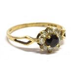 A SAPPHIRE AND WHITE CUBIC ZIRCONIA CLUSTER GOLD DRESS RING 1.6 gram, size O, the traditional
