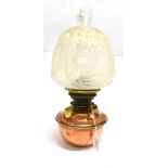 A COPPER AND BRASS OIL LAMP with moulded glass shade, 41cm high overall; an oak and brass gallery