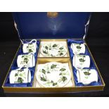 A COALPORT COFFEE SET comprising six coffee cans and saucers, boxed