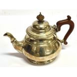 A MAPPIN & WEBB SILVER TEAPOT the pear shaped teapot with facetted spout and line rim, 15cm high,