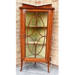 AN EDWARDIAN CORNER DISPLAY CABINET with inlaid decoration