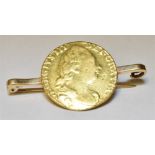 A ONE GUINEA GOLD COIN BAR BROOCH The coin dated 1784 soldered to a 9ct gold bar brooch,