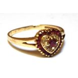 A RUBY AND DIAMOND HEART SHAPED CLUSTER RING Yellow gold claw settings, split shoulders to a