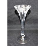 AN 18TH CENTURY WINE GLASS the trumpet shaped bowl engraved with vine leaves and grapes, on plain