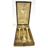 A CASED SET OF THREE RUSSIAN SILVER GILT SPOONS with black niello highlights to floral decoration,