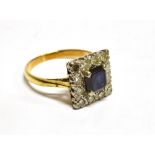 A SAPPHIRE AND DIAMOND SQUARE CLUSTER 18 CT GOLD RING the central square cut dark blue sapphire