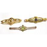 THREE LATE VICTORIAN 9CT GOLD BAR BROOCHES comprising amethyst and seed pearl set, peridot and