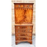 A REPRODUCTION FIGURED MAHOGANY SECRETAIRE A ABBATANT with pair of drawers above fall front