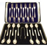 A BOXED SET OF TWELVE SILVER TEASPOONS With sugar tongs, Birmingham hallmark for 1934; together with