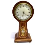 AN EDWARDIAN MAHOGANY BALLOON CASED MANTLE CLOCK with mother-of-pearl and brass inlaid decoration,