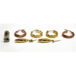 THREE PAIRS OF ASSORTED 9CT GOLD EARRINGS comprising two pairs of hoops and a pair of drop torpedo