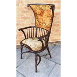 A MAHOGANY WINDSOR ARMCHAIR IN THE MANNER OF LIBERTY with shaped wing back and kidney shaped seat