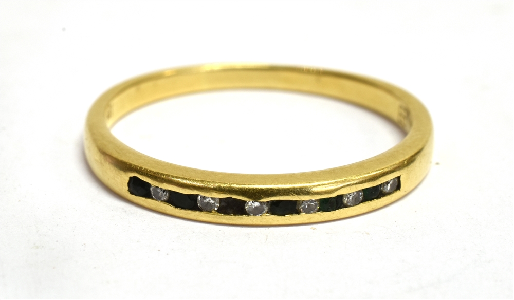 AN 18CT YELLOW GOLD BAND RING Channel set to front with six small diamonds alternating with small