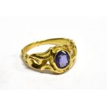 A SAPPHIRE SINGLE STONE SET YELLOW GOLD RING the oval mixed cut sapphire 6.5mm x 5.5mm scroll rub