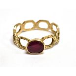 A RUBY SINGLE STONE SET DRESS RING Note: the ruby glass filled treated, gross weight 1.7 grams