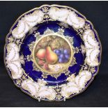 A ROYAL WORCESTER CABINET PLATE the centre painted with fruit, signed 'Sebright', on a Royal blue