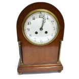 AN EDWARDIAN MAHOGANY MANTLE CLOCK with enamel dial, the 8-day movement striking on a coiled gong
