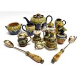 A LARGE COLLECTION OF DOULTON LAMBETH SALTGLAZE STONEWARE ITEMS including cruet est, desk standish