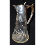 A SILVER TOPPED CUT GLASS CLARET JUG The plain silver top hallmarked Birmingham 1912, makers mark