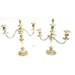 A PAIR OF SILVER PLATED THREE LIGHT CANDELABRA with shell mark to base, together with a silver