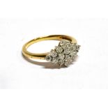 A DIAMOND MARQUISE SHAPED CLUSTER YELLOW GOLD RING a total of sixteen small illusion set diamonds,