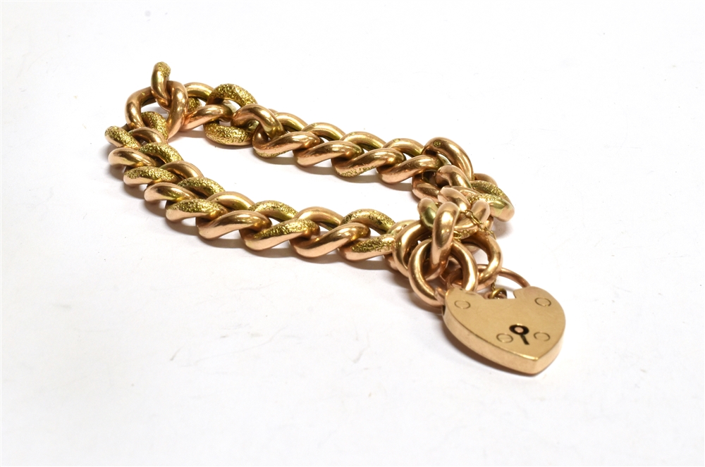 AN EDWARDIAN 9CT GOLD BRACELET WITH PADLOCK FASTENER the twisted curb links of hollow construction