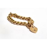 AN EDWARDIAN 9CT GOLD BRACELET WITH PADLOCK FASTENER the twisted curb links of hollow construction