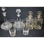 A GROUP OF FOUR VARIOUS GLASS DECANTERS including a pair of square whisky decanters 22.5cm high