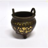 A CHINESE BRONZE INCENSE BURNER with gold splash decoration, bearing Xuande mark to base, 11cm