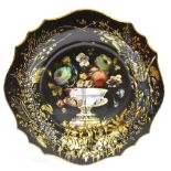 A VICTORIAN PAPIER MACHE PLATE with mother-of-pearl and painted floral decoration, 27cm diameter