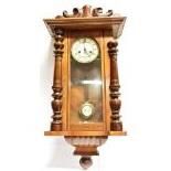 A CONTINENTAL WALNUT CASED GUSTAV BECKER WALL CLOCK with spring driven movement, the case 41cm