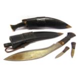 MILITARIA - A PAIR OF NEPALESE KHUKURI KNIVES of traditional form, each in a brass-tipped leather