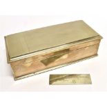 A SILVER CASKET FORM CIGARETTE BOX The long rectangular box with engine turned decorated lid,