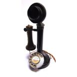A RING-DIAL CANDLESTICK TELEPHONE with a bakelite mouthpiece, overall 30.5cm high, (requires re-