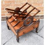 A WILLIAM IV ROSEWOOD THREE DIVISION ROSEWOOD CANTERBURY on brass casters, 48cm wide 40cm deep