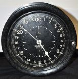 A US NAVY 24 HOUR CIRCULAR WALL CLOCK the black dial inscribed 'US NAVY 24455-E' and 'MADE BY SETH