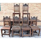 A SET OF SIX OAK DINING CHAIRS the backs with carved top rail, solid seats on straight supports with