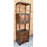 A CHINESE METAL MOUNTED DISPLAY STAND fitted with cupboard, over shelves and pair of drawers and