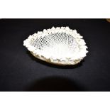 A BELLEEK PORCELAIN HEART SHAPED BASKET the rim with floral decoration, approx 13cm wide