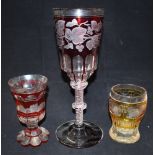 A LARGE 19TH CENTURY BOHEMIAN FLASH CUT GLASS GOBLET with air twist stem, 30cm high; together with